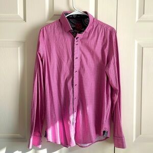 Pink long sleeve button up shirt with black and white designs